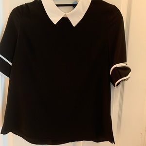 Like new, CeCe top w bow motif on sleeve.